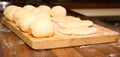 Dough lumps on a chopping board for future pies Royalty Free Stock Photo